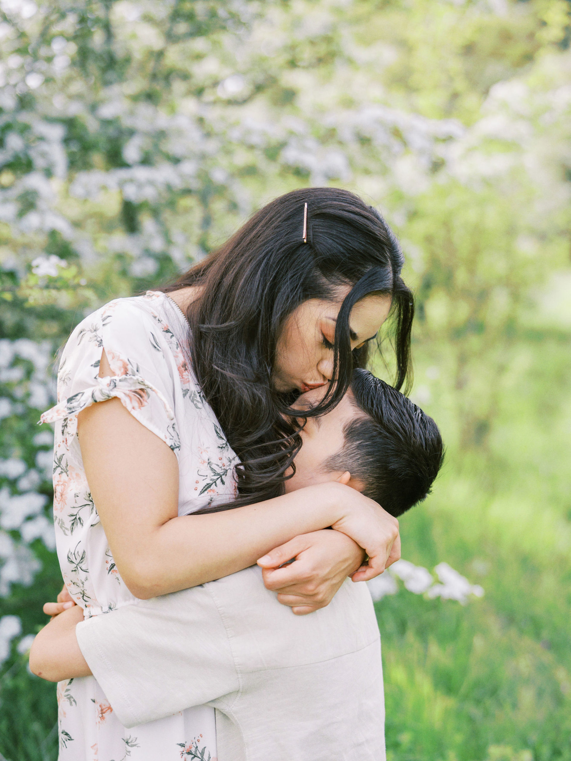 Mother kissing son on the forehead