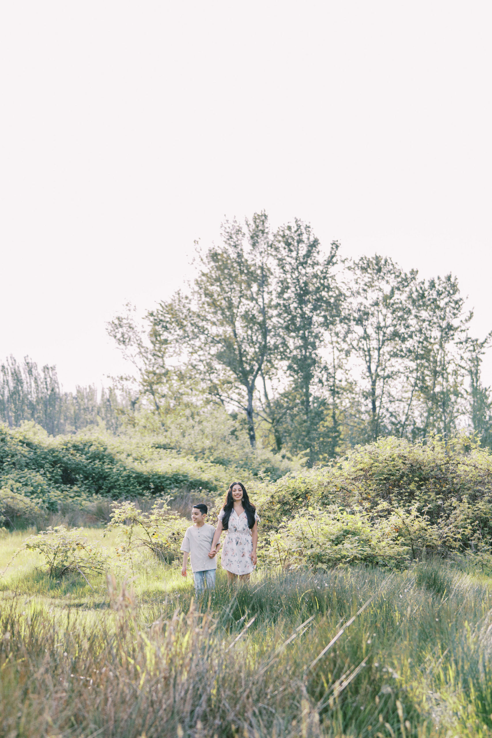 Mother and son standing in the distance