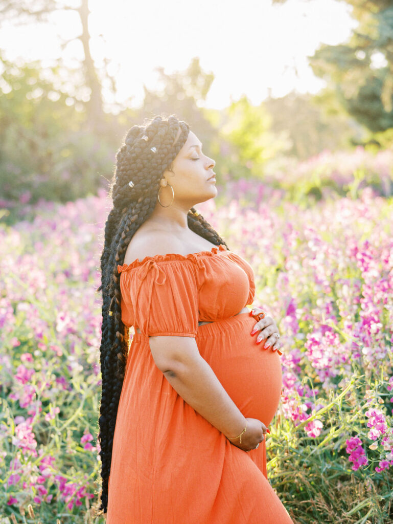 Summer maternity photos in Discovery Park in Seattle during sweet pea bloom season