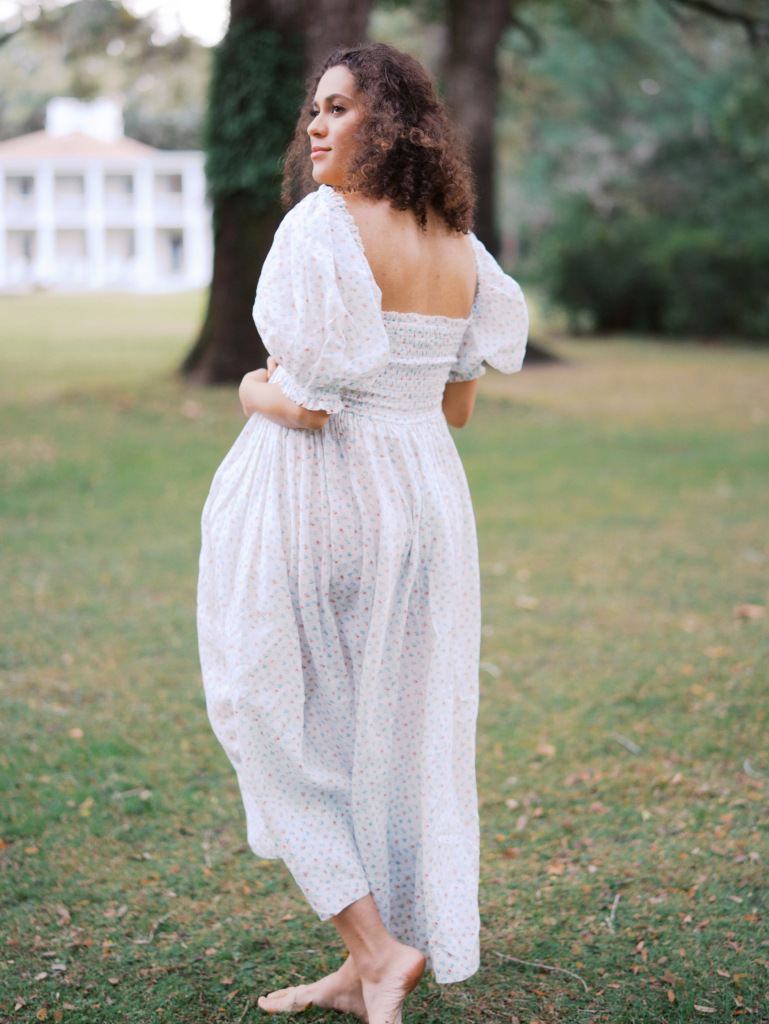 Expectant mom wearing a flowy dress at her maternity session by photographerTanya Zagumenov