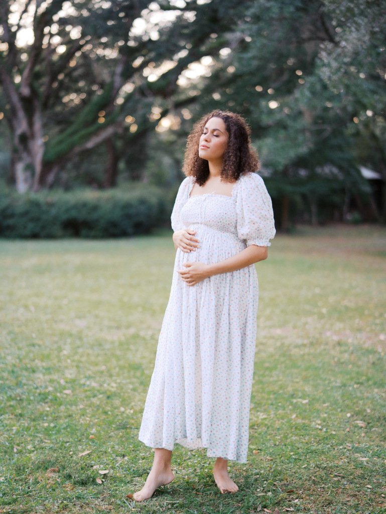 Mom wearing a white flowy dress for Seattle maternity photos by Seattle maternity photographer Tanya Zagumenov